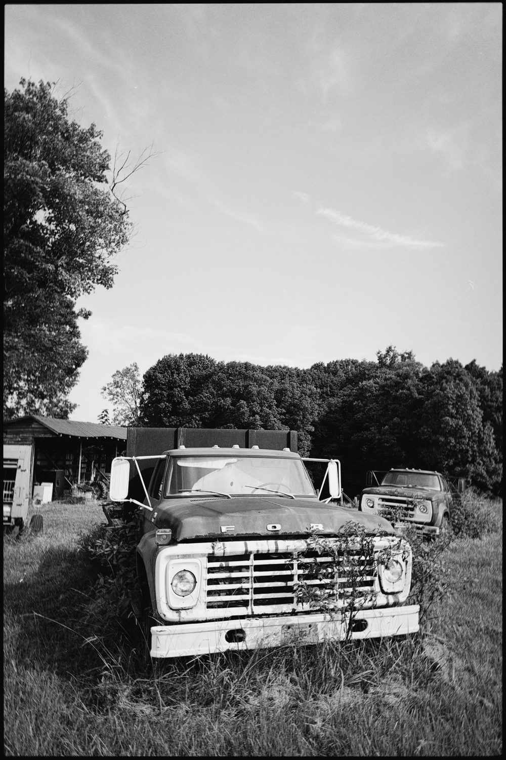black and white photograph of cars, by Stuart Singleton